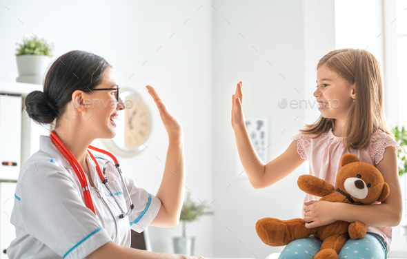 Doctor examining a child - Stock Photo - Images