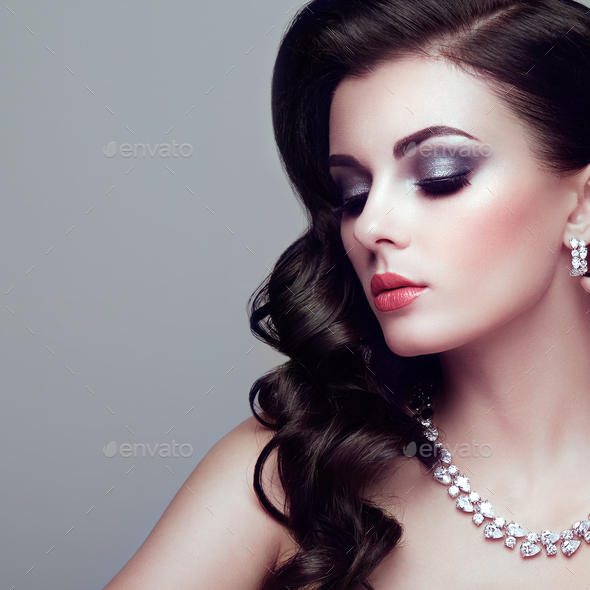 Brunette woman with long shiny wavy hair - Stock Photo - Images