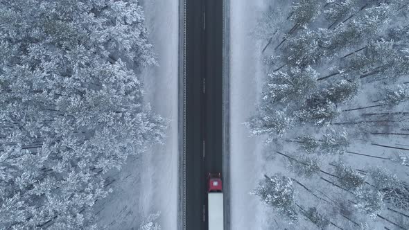 Truck Driving on Road in Winter Top Down View alt