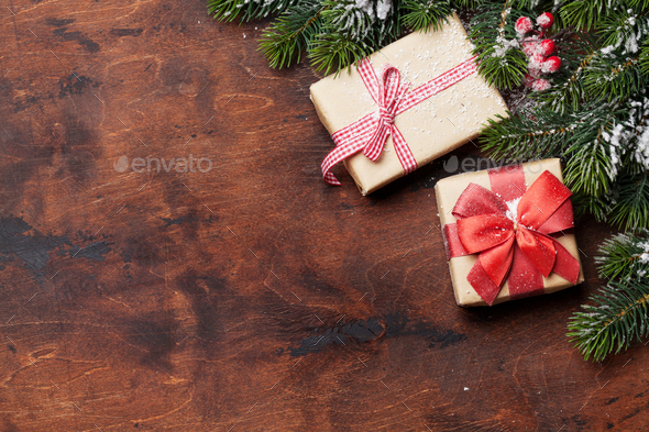 Christmas gift boxes and fir tree branch - Stock Photo - Images