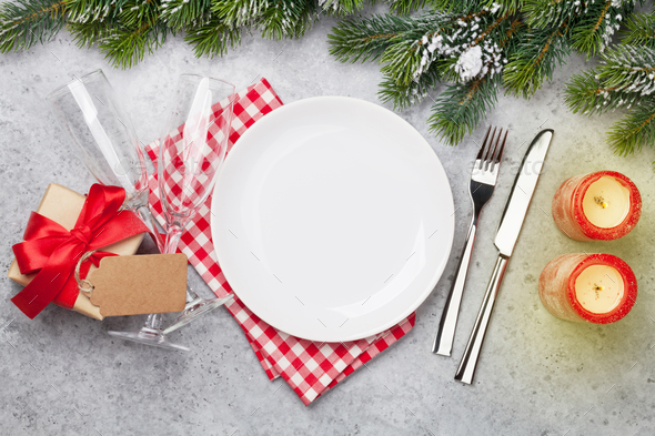 Christmas table setting with champagne and xmas gift - Stock Photo - Images