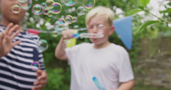 Boys blowing bubbles
