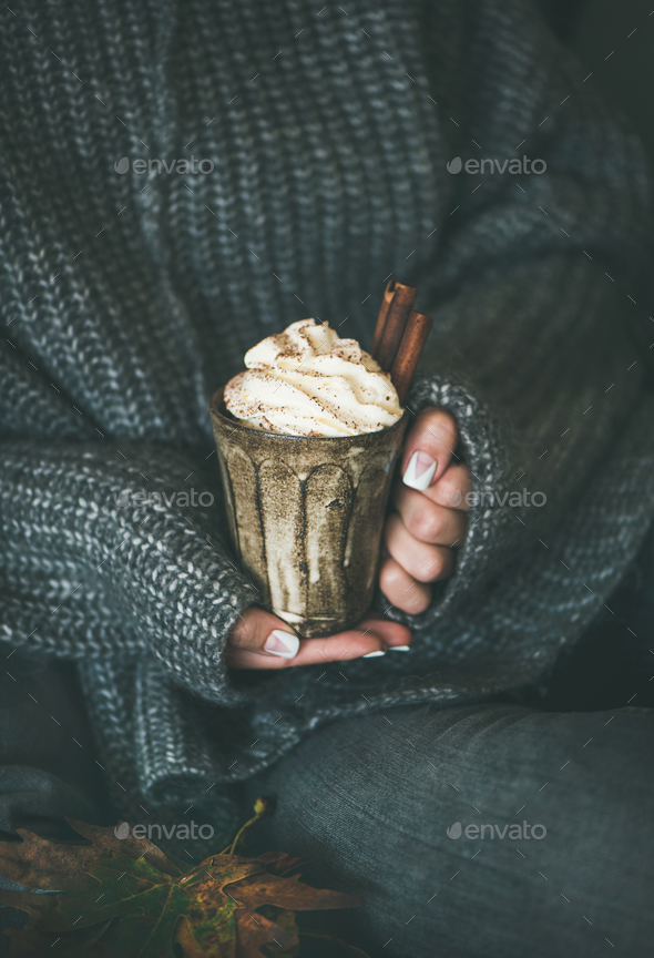 Woman in grey woolen sweater with mug with hot chocolate - Stock Photo - Images