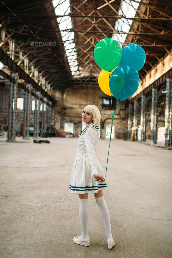 Anime style blonde lady with colorful air balloons - Stock Photo - Images