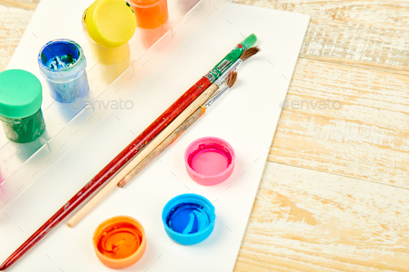 Watercolor palettes and paint brushes. Artist workplace - Stock Photo - Images