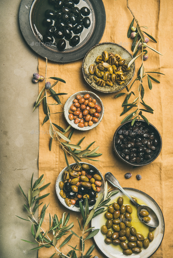 Mediterranean pickled olives and olive tree branches, top view - Stock Photo - Images