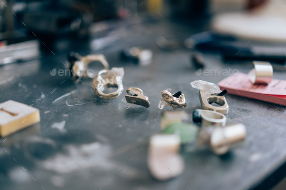 Different jewelery on the table from the jeweler from a close angle - Stock Photo - Images