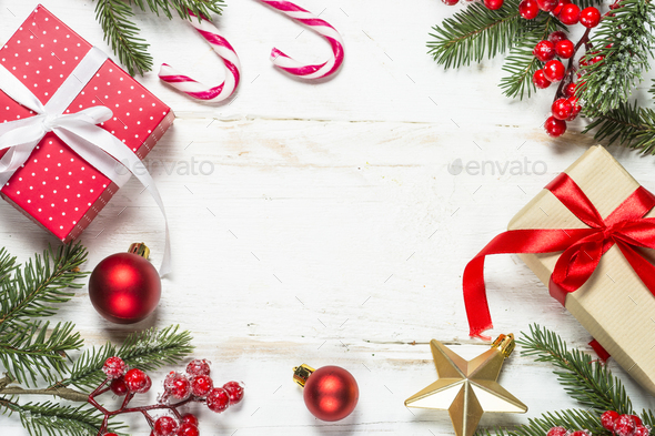 Christmas background with fir tree, present box and decorations Stock Photo by Nadianb