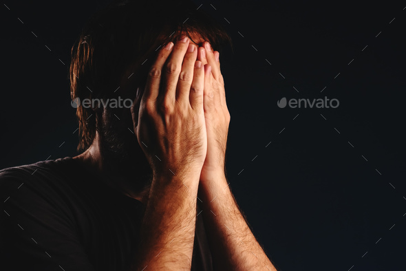 Man is crying in despair - Stock Photo - Images