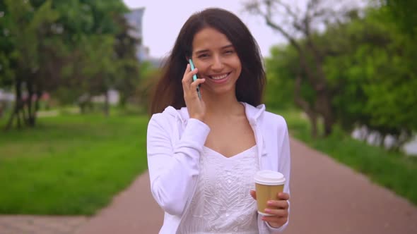 Woman Talking By Phone on the Run alt