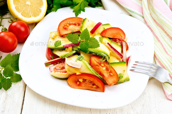 Salad with zucchini and vegetables on board - Stock Photo - Images