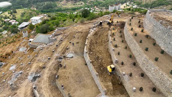 Farmers build an avocado garden in the mountains aerial view 4 K alt