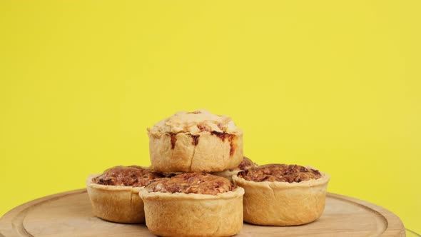 baked portion dish quiche with chicken and mushrooms on a wooden board alt