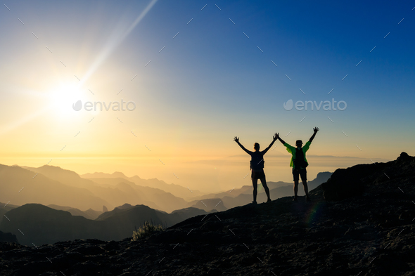 Couple hikers success and trust concept in mountains - Stock Photo - Images