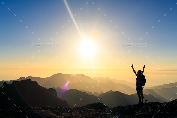 Woman hiking success silhouette in mountains sunset - Stock Photo - Images