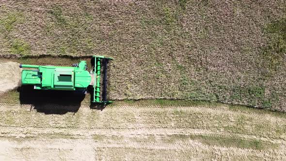 Harvester from a bird's eye view works in the field