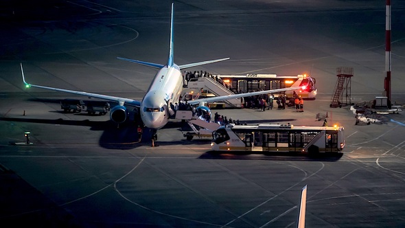Boarding The Plane At Airport alt