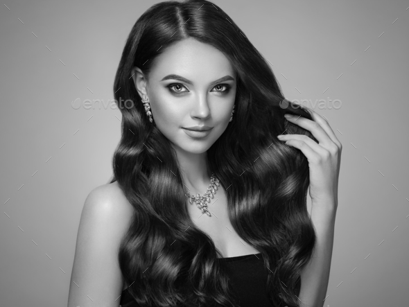 Brunette woman with curly hair - Stock Photo - Images