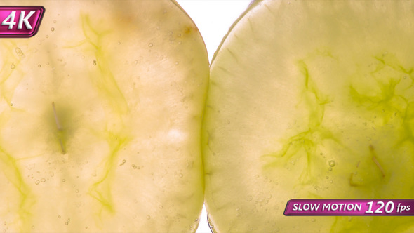 Compressing Two Green Grape Halves alt