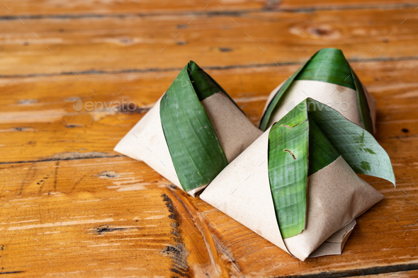 Simple authentic nasi lemak wrapped in banana leaf, popular breakfast in Malaysia Stock Photo by ThamKC