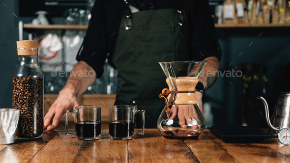 Two Glass Mugs of Chemex Coffee On Wooden Table