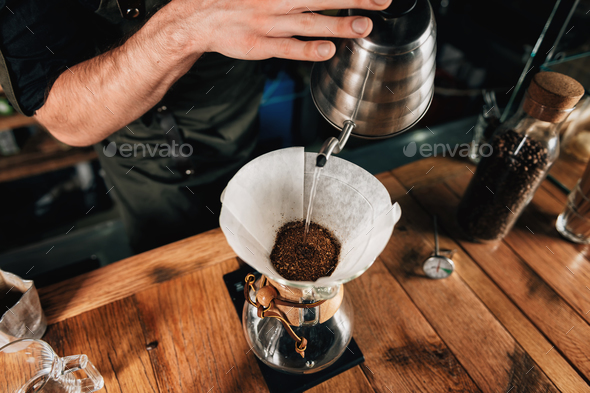 https://s3.envato.com/files/256229541/Barista_Making_Coffee_3687_f1.jpg