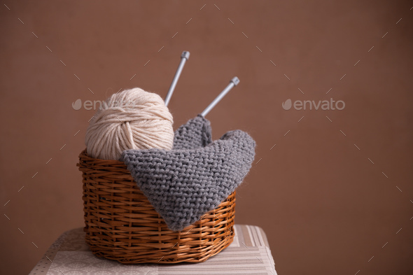 Basket witn yarn ball knitting and needles - Stock Photo - Images