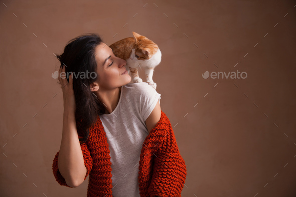 Little kitten on woman shoulder - Stock Photo - Images