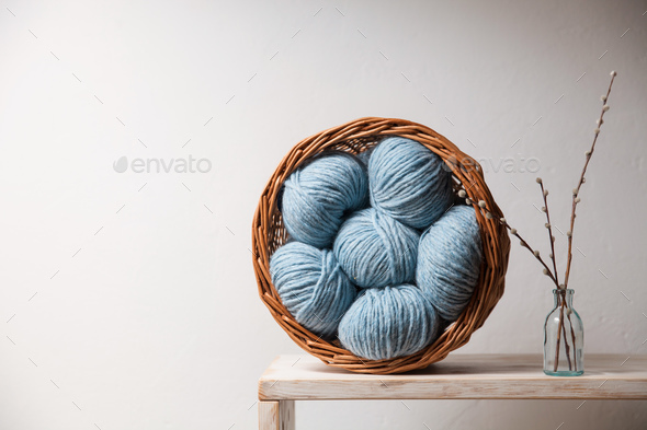 Closeup of basket with colorful yarn clews - Stock Photo - Images