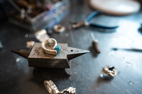 Different jewelery on the table from the jeweler from a close angle - Stock Photo - Images