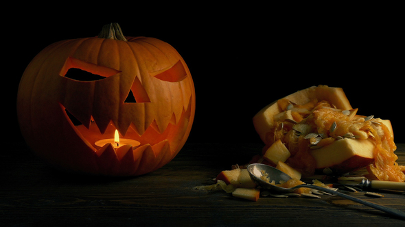 Pumpkin Carving On Table - Halloween Concept alt