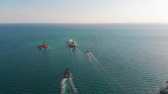 The Bulk Carrier Left the Port and Moves in the Right Direction at High Speed. alt