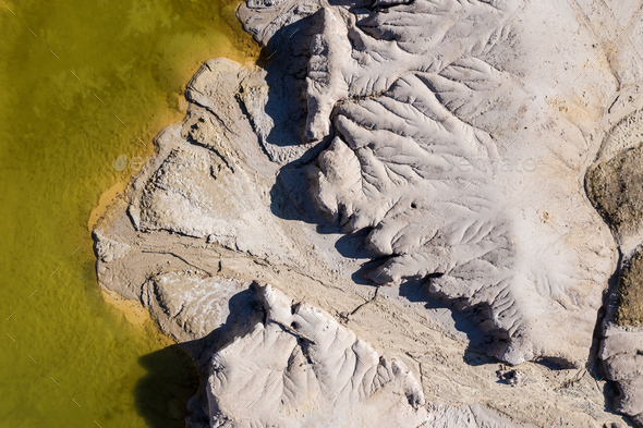 Surrealistic aerial image of abandoned opencast mine. Bad land pattern from a drone