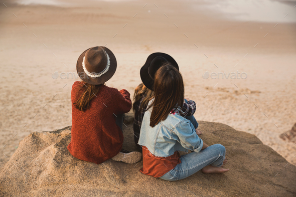 Girs enjoying  a day on the beach - Stock Photo - Images