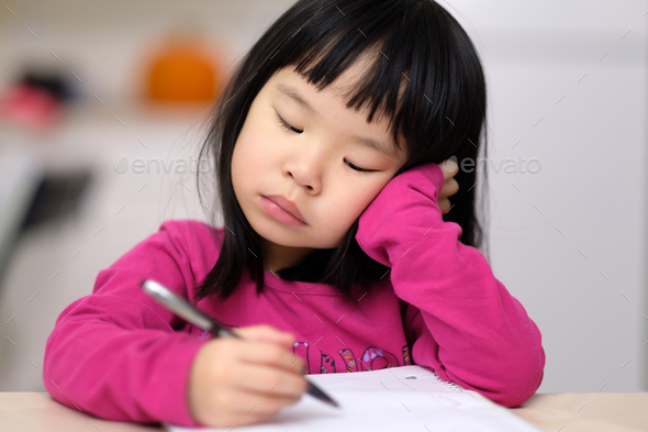 Early childhood education concept with little girl learn to write