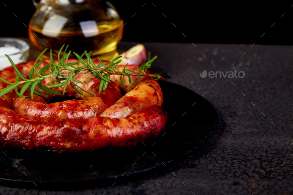 Grilled or Roasted spiral pork sausages with rosemary - Stock Photo - Images