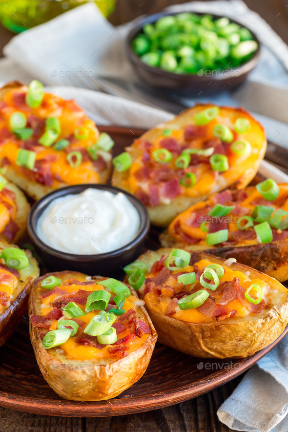 Baked Loaded Potato Skins With Cheddar Cheese Bacon Garnished Stock Photo By Iuliia N