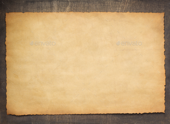 old retro aged paper parchment at wood Stock Photo by seregam