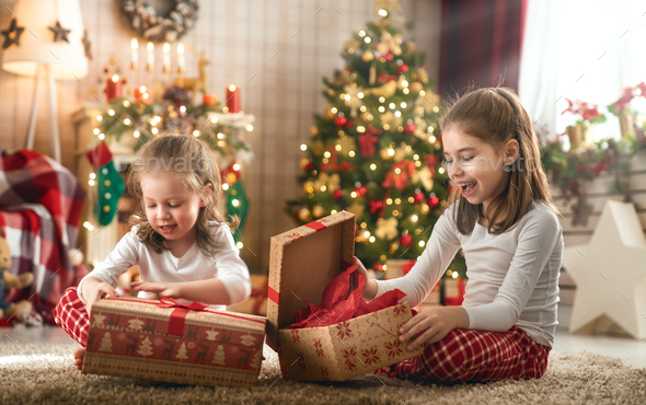 children opening presents