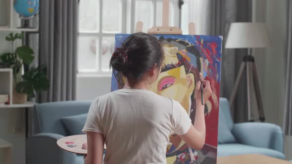 Asian Artist Girl Coming To Sit And Holding Paintbrush Mixed Colour Before Painting alt