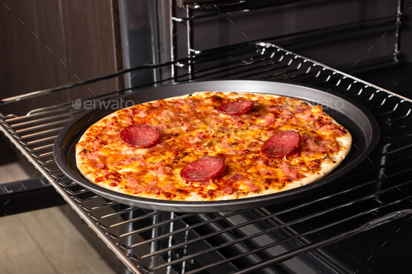 Cooking Homemade Pizza In An Electric Oven Stock Photo By Nataliia Pyzhova