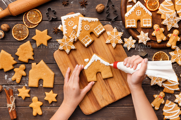 christmas bakery: Girls preparing christmas cookies, top view with  sifferent baking supplies, chaotic table Stock Photo - Alamy