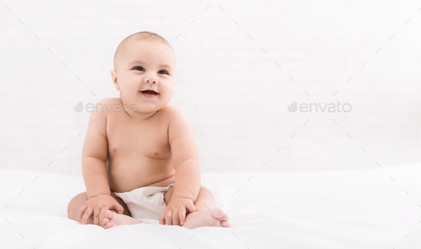 cute baby sitting on white background copy space cute baby sitting
