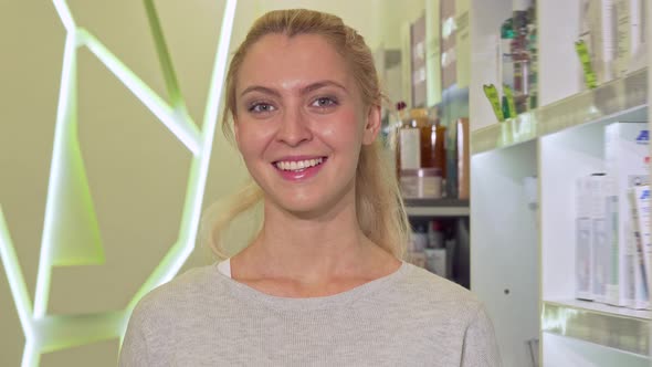Happy Healthy Woman Showing Thumbs Up, Holding Blister of Pills at Drugstore alt