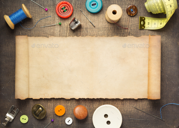 Creative sewing supplies and accessories on a table Stock Photo by