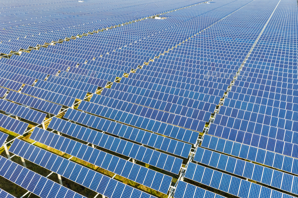 arrays of blue solar panels on photovoltaic power station, aerial view ...