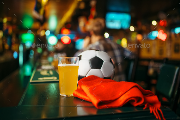 Ball, beer and scarf in sports bar, fans lifestyle