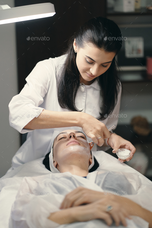 Close-up of the face of a young woman relaxing under the gentle - Stock Photo - Images