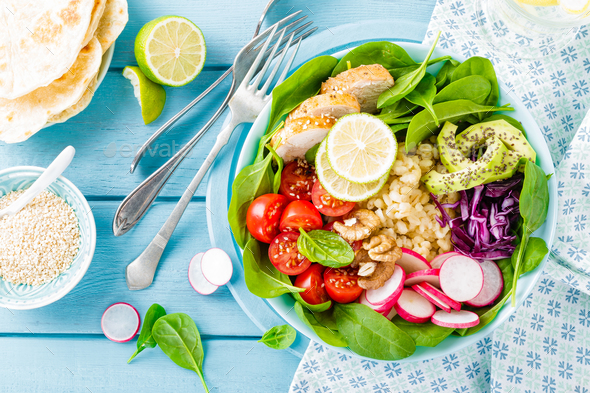 Bowl with grilled chicken meat and fresh vegetables - Stock Photo - Images