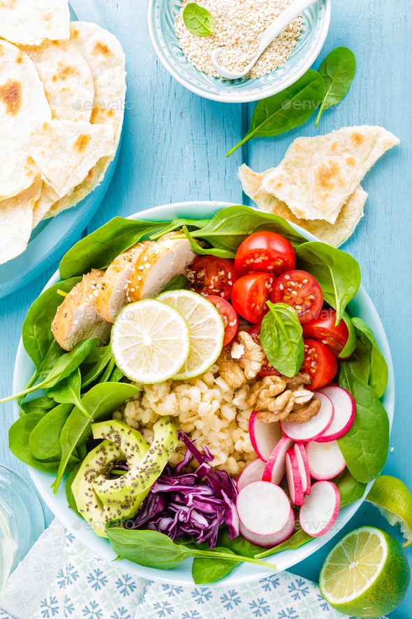 Bowl with grilled chicken meat and fresh vegetables - Stock Photo - Images